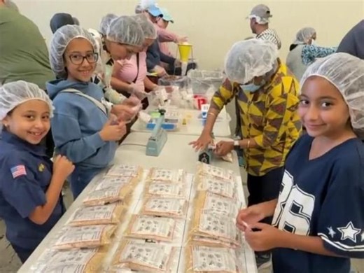 Volunteers pack food boxes at Rise Against Hunger Warehouse in Raleigh
