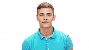 Young sportive man laughing showing muscles over white background Slow motion