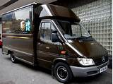 Package Delivery Company With Brown Trucks Photos