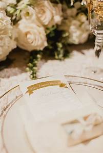 An Elegant Table Setting With White Flowers And Champagne