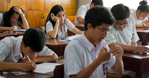 Indonesian students taking notes