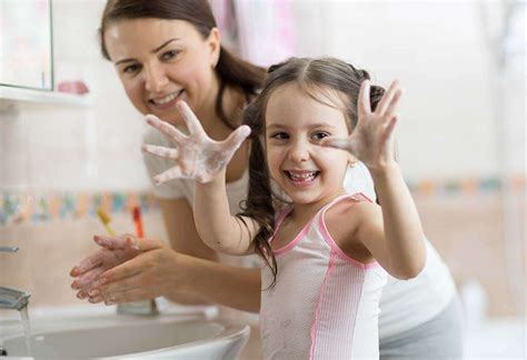 Child washing hands before eating
