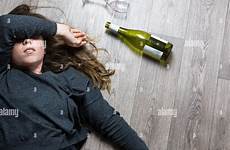 drunk young drinking bottle sick floor girl lying alcoholic feeling empty wine glass red woman stock alamy sleeping sofa