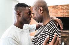 gay kissing men house embracing couple stock