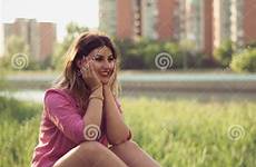 shorts woman sitting wearing denim beautiful sexy attractive concrete casual river side macrame preview
