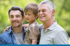 father son grandfather smiling park shoulders preview male