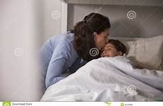 kissing goodnight daughter bedtime mother preview
