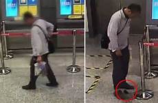 pants poop china floor subway his craps dude onto shakes leg inside then stomp public singapore straitstimes seen shit