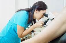 gynecology gynecologist patient exams hospital examining gyn ob colposcope asian using doctor rocky mountain woman