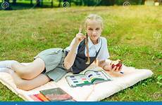 schoolgirl pigtails portrait park apple teenager coverlet sitting preview