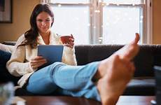 barefoot couch woman stock weekend istock
