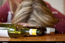drunk blonde woman bottles empty alcohol young alamy posed