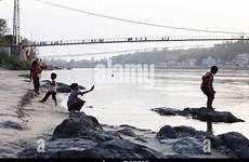 ganges river indian children banks each play young other varanasi playing rishikesh india alamy rm