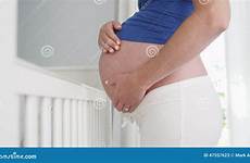 rubbing belly pregnant woman her crib standing stock