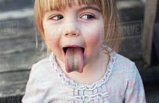 tongue girl young sticking green sucking candy ring after ontario toronto canada dissolve stock d869