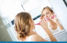 brushing teeth pretty female mirror front her hard too stock dreamstime silly checking faces morning skin making why people