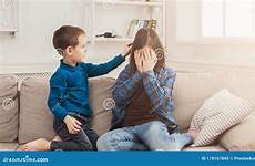 sister crying boy his brother calming down sad care