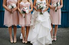 holding bridesmaids