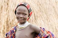girl young karo tribes ethiopia omo valley photoscope breastfeeding shyly smiled while