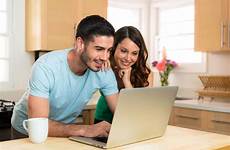 computer laptop couple wife husband smiling sharing searching laughing coffee network social funny jobs hacks saving awaited money trip most