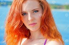 bikini red hair girl beautiful beach posing sexy preview
