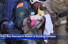dies rubble rescued beneath