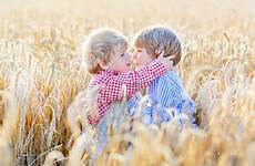 hugging sibling wheat