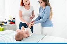 massage baby therapist female newborn teaching concept mother boy young her