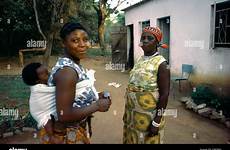 zambia village women baby alamy stock back