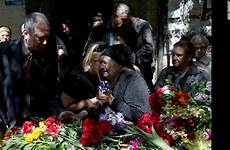 ukraine funeral who ukrainian mother cnn mariupol charge answer coffin