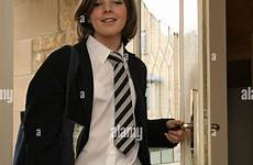 school uniform girl door front coming alamy through her