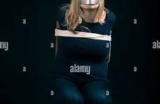 tied woman tape kidnapped stock rope hostage mouth young alamy over together abuse hands