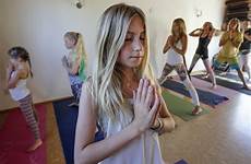yoga girl instructor youngest devoe teacher years spa teaches san class female classes her yogis masslive encinitas diego local students