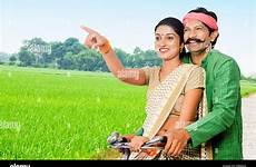 farmer bicycle riding married pointing