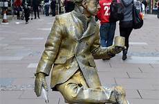 living statue statues human man golden unusual centre people amazing city dailymail who face bath hell pushed over his guy
