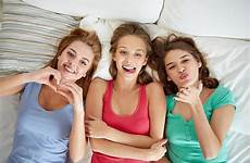 teens tweens bed sleep girls bedtime party people time teenage pajama fun matters too teenager happy lying friendship having concept