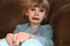 little girl cries over