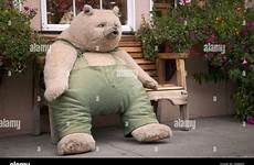 bear teddy sitting bench stuffed sidewalk alamy wooden life size