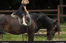 saddle rider child ride sit horse girl
