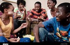 african teenagers group eating sit lounge alamy together