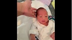 Baby has a cute sneeze while waiting with mom after birth!