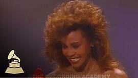 Whitney Houston accepting the GRAMMY for Best Pop Vocal Performance at the 28th GRAMMYs | GRAMMYs
