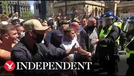 Right-wing protesters attack riot police in London