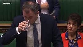 Health Minister Edward Argar seen struggling with cough in Commons