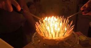Lighting and blowing out 100 birthday candles