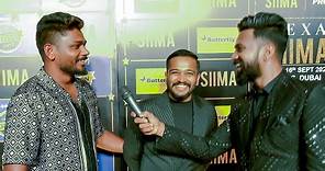 Cricketer Sanju Samson and Director Basil Joseph share some laughs on the red carpet