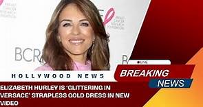 Elizabeth Hurley Is ‘Glittering in Versace’ Strapless Gold Dress in New Video