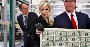 Treasury Secretary Mnuchin and his wife mocked for posing with a sheet of money