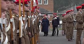 Queen inspects troops and takes the salute from The Royal Lancers