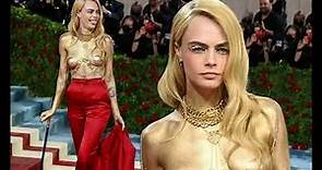 Cara Delevingne rips off her red jacket to unveil gold painted body during shock red carpet arrival